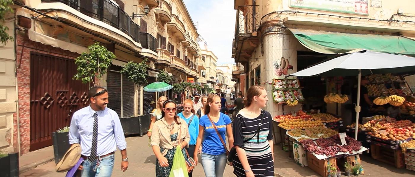 学生 walking together through the streets of Tangier.